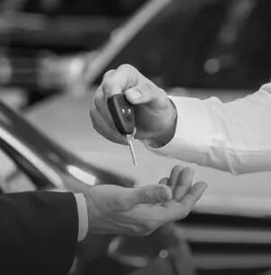 Hands exchanging car keys to confirm request